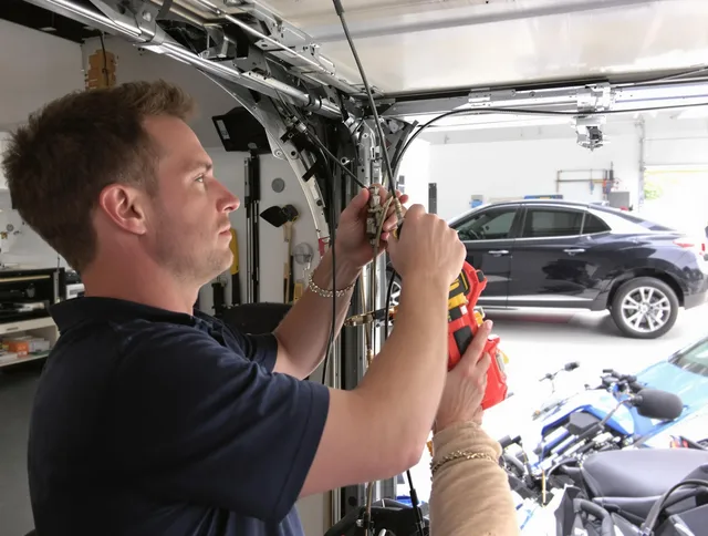 Sunrise Garage Door Repair safety certified technician performing cable replacement in Sunrise