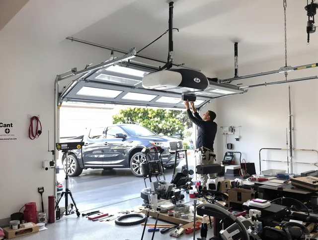 Sunrise Garage Door Repair specialist installing smart garage door opener system in Sunrise home