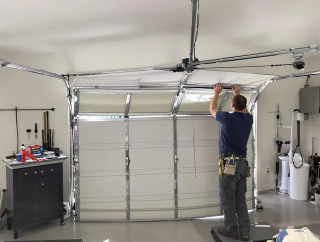 Sunrise Garage Door Repair specialist performing precise section replacement on Sunrise garage door